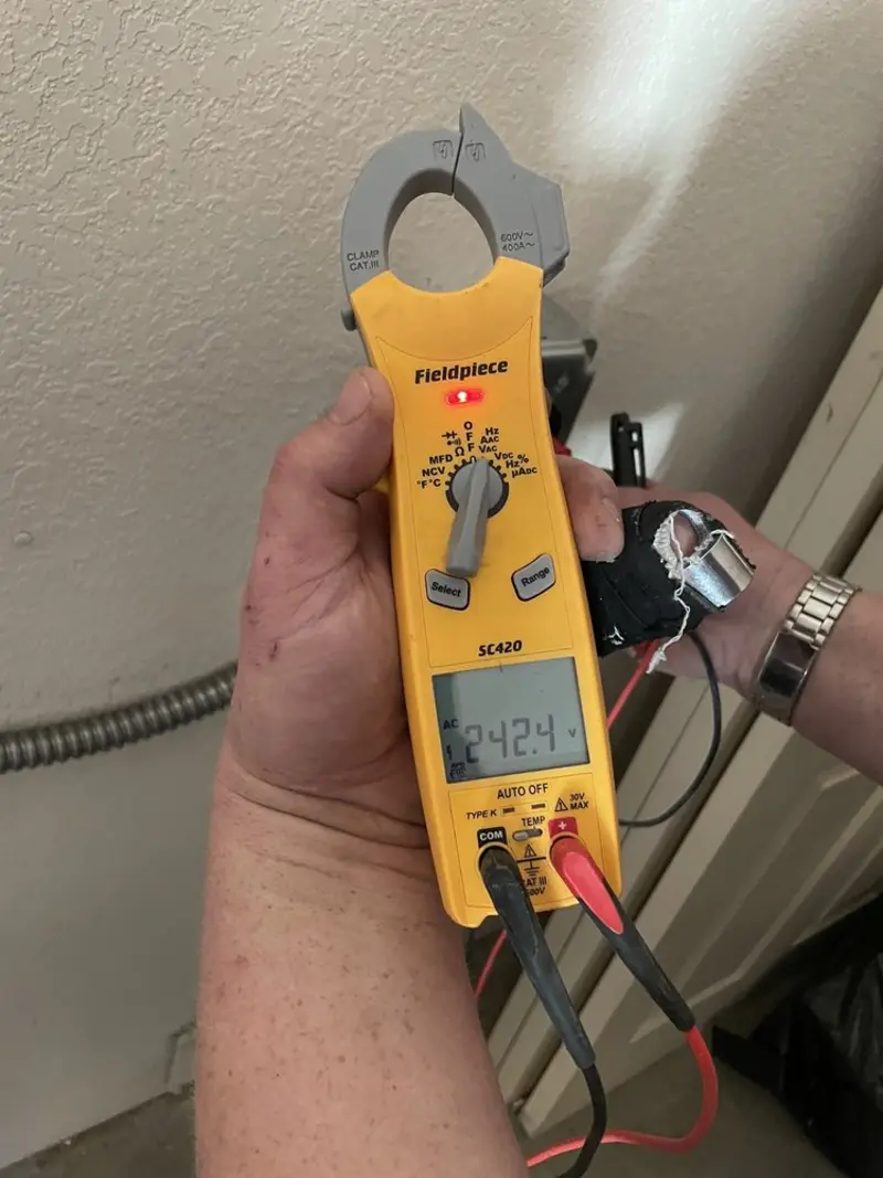 Voltage testing with clamp meter during Aluminum Wiring Replacement in McNair